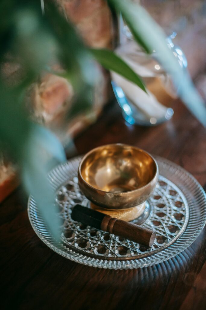 Calm and cozy interior scene featuring a Tibetan singing bowl on a decorative plate.